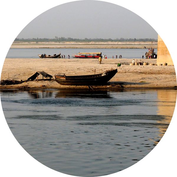 a boat under a bridge on the Ganges, Patna, Bihar • India